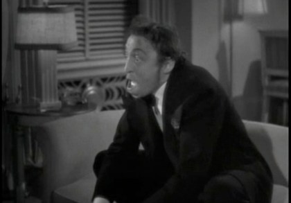 Carlo (Mischa Auer) attempts to cheer up Irene...